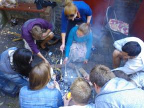 Toasting marshmallows at our summer barbeque
